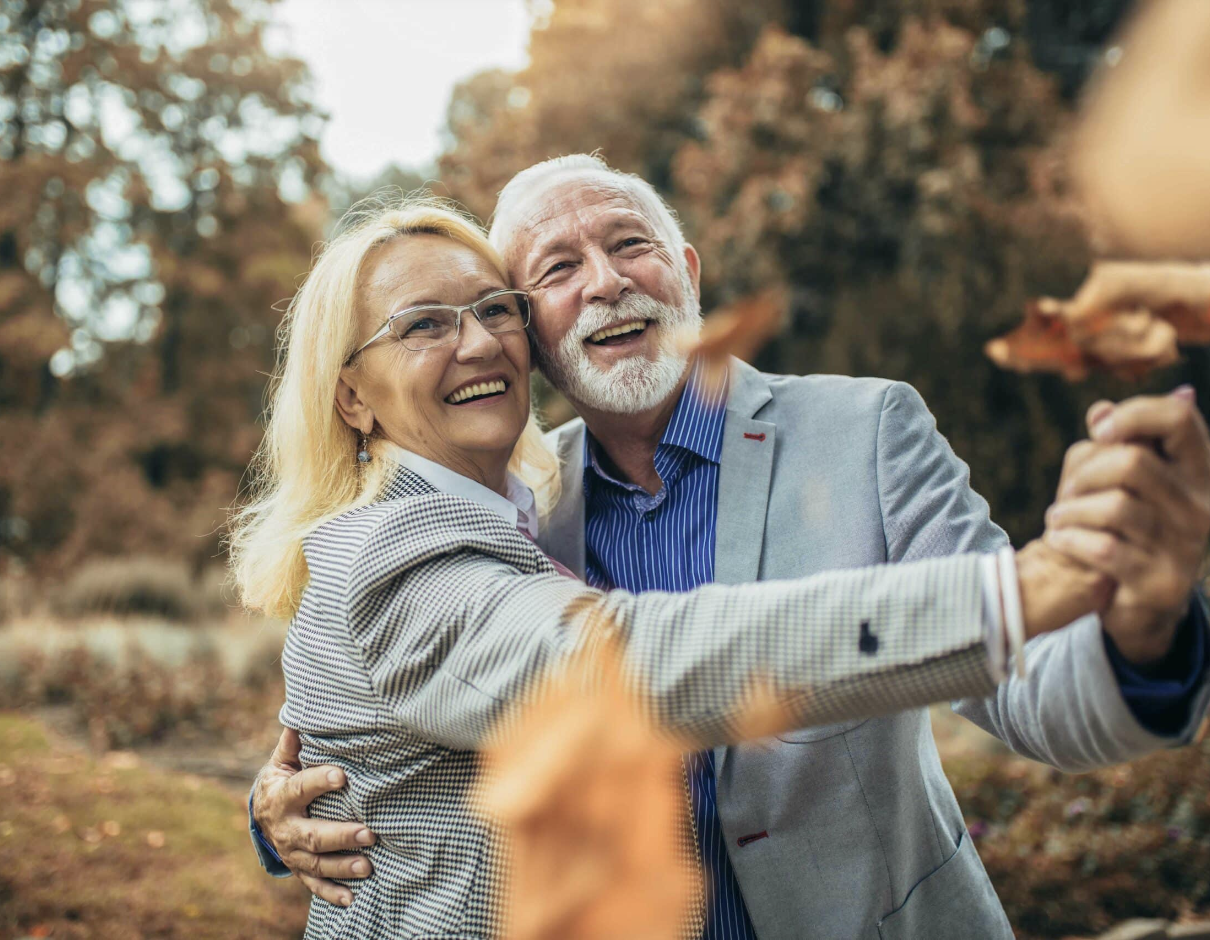 Smiling older couple dancing