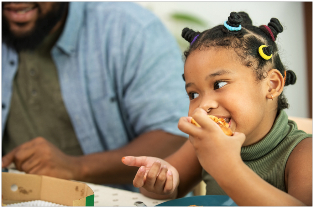 young child eating lunch