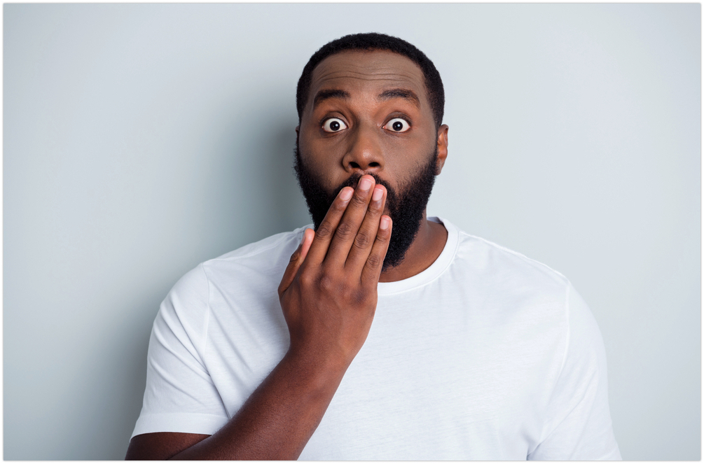 A man covering his mouth with his hand