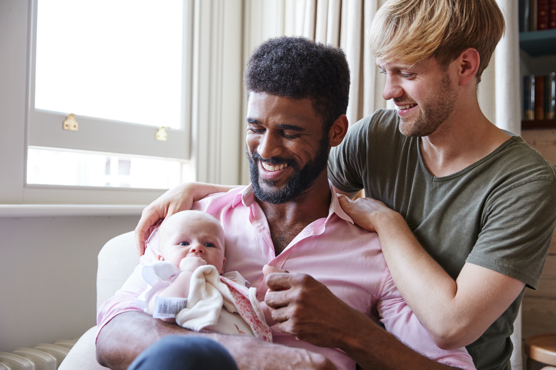 same-sex male couple with a baby